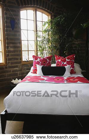 Pink floral accents on bed View Large Photo Image Stock Photography - Pink floral accents on bed. Fotosearch