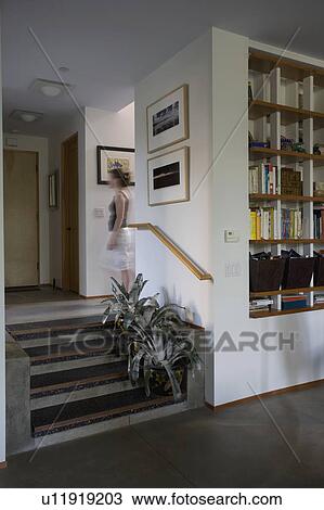 Stock Image - Plants on small staircase in traditional home. Fotosearch