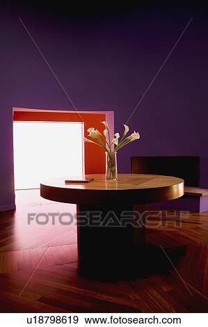 Stock Photo - Purple room with large doorway and circular table. Fotosearch