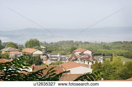 Stock Photo - Red tile roofs on Italian countryside. Fotosearch