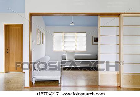 Stock Photo - Sliding pocket doors to modern living room. Fotosearch