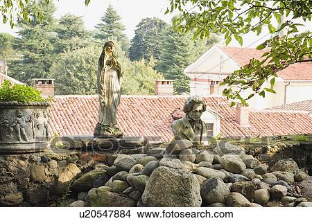 Picture - Statues in side yard of old Italian castle. Fotosearch