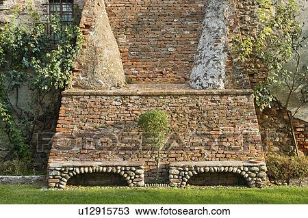 Stone benches along brick castle exterior View Large Photo Image Stock Image - Stone benches along brick castle exterior. Fotosearch