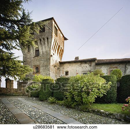 Stock Image - Stone driveway along Historic Italian Castle. Fotosearch
