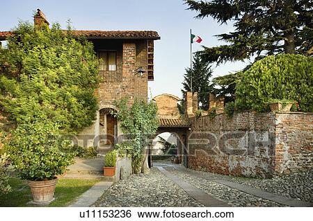 Stock Photograph - Stone driveway leading up to old Italian castle. Fotosearch