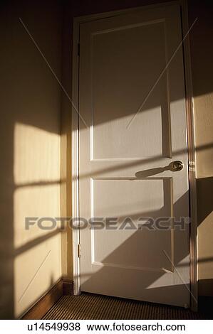 Sunlight streaming over the door View Large Photo Image Stock Photo - Sunlight streaming over the door. Fotosearch