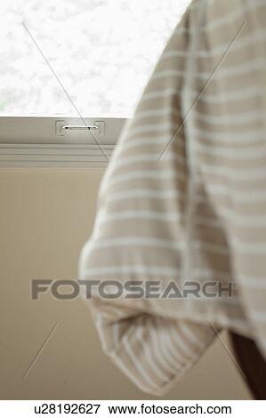 Window detail behind comforter on bed View Large Photo Image Stock Photo - Window detail behind comforter on bed. Fotosearch
