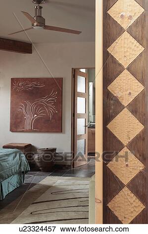 Wooden around doorway to bedroom in green and recycled home View Large Photo Image Stock Photo - Wooden around doorway to bedroom in green and recycled home. Fotosearch