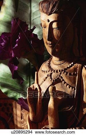 Picture - Wooden Buddha statue. Fotosearch