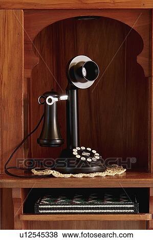 Stock Photo - Wooden niche with telephone. Fotosearch