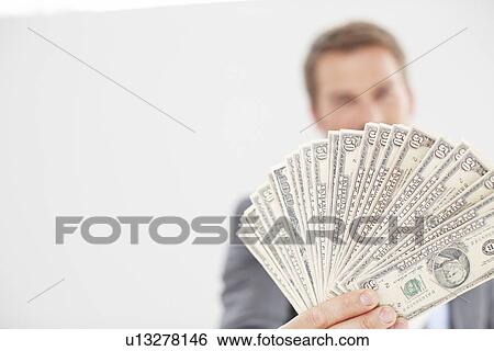A fan made of dollars View Large Photo Image Stock Photograph - A fan made of dollars. Fotosearch