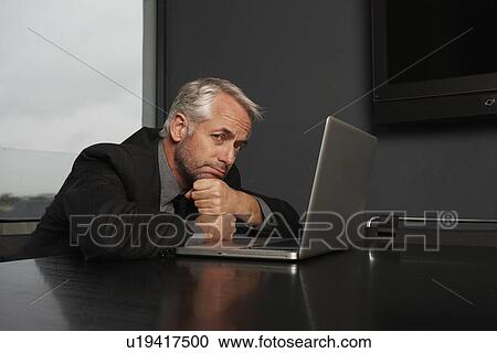 Stock Image - A pessimistic businessman. Fotosearch