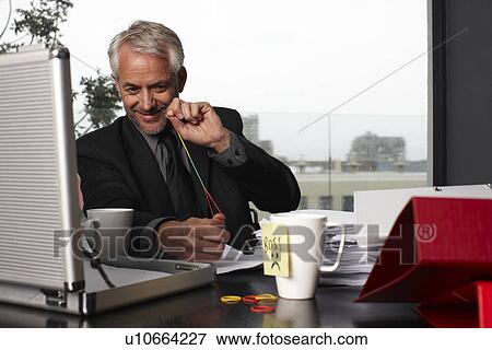 Stock Photo - A playful boss. Fotosearch