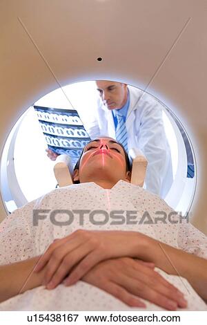 Stock Photo - Analyzing a brain scan. Fotosearch