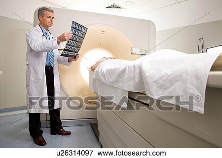 Analyzing a brain scan View Large Photo Image Stock Photo - Analyzing a brain scan. Fotosearch