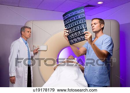 Analyzing a tomography View Large Photo Image Stock Photo - Analyzing a tomography. Fotosearch