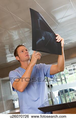 Analyzing an x-ray View Large Photo Image Stock Photograph - Analyzing an x-ray. Fotosearch