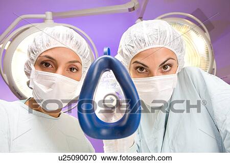 Anesthesiologist putting an oxygen mask on View Large Photo Image Stock Image - Anesthesiologist putting an oxygen mask on. Fotosearch