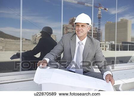 Stock Photo - Architect at a construction site. Fotosearch