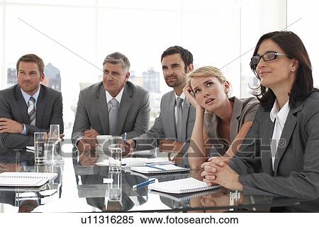 At a boring meeting View Large Photo Image Stock Photography - At a boring meeting. Fotosearch