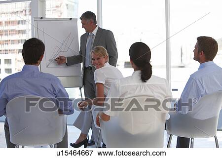 Stock Photo - At a presentation. Fotosearch