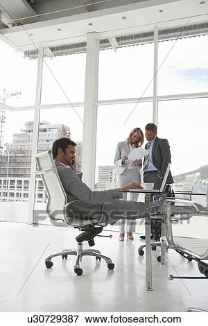 At an office View Large Photo Image Stock Photo - At an office. Fotosearch