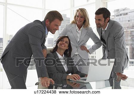 Attractive boss with her team View Large Photo Image Stock Photo - Attractive boss with her team. Fotosearch