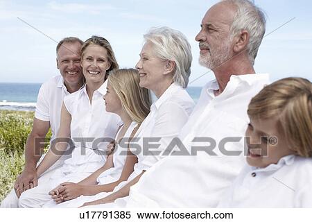 Stock Photography - Attractive couple with their family. Fotosearch