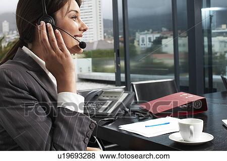 Stock Photo - Attractive customer support agent. Fotosearch