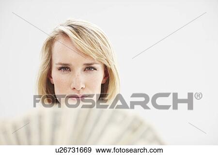Stock Photo - Attractive girl with banknotes. Fotosearch