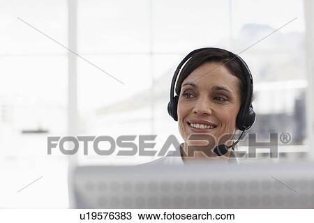 Stock Image - Attractive sales agent. Fotosearch