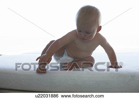 Baby in diapers View Large Photo Image Stock Photograph - Baby in diapers. Fotosearch