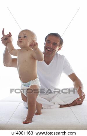 Baby learning to walk View Large Photo Image Stock Image - Baby learning to walk. Fotosearch