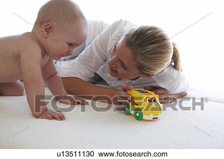 Beautiful mother with her baby boy View Large Photo Image Stock Image - Beautiful mother with her baby boy. Fotosearch