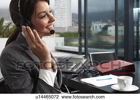 Stock Image - Beautiful receptionist. Fotosearch