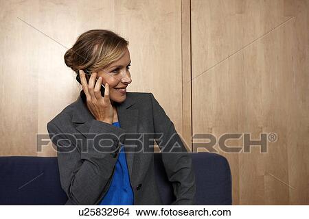 Beautiful woman on a phone View Large Photo Image Picture - Beautiful woman on a phone. Fotosearch