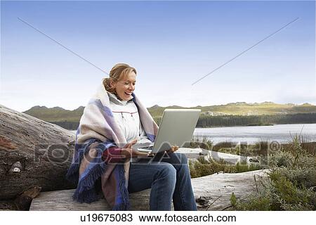 Beautiful woman with a computer View Large Photo Image Stock Image - Beautiful woman with a computer. Fotosearch
