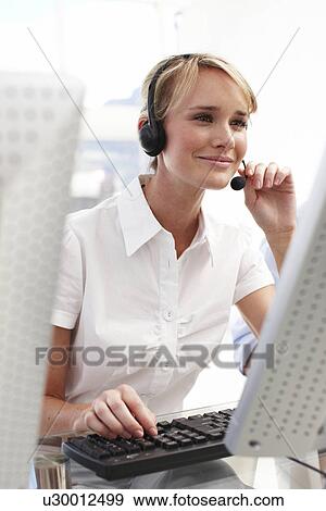 Blond girl at work View Large Photo Image Stock Photo - Blond girl at work. Fotosearch