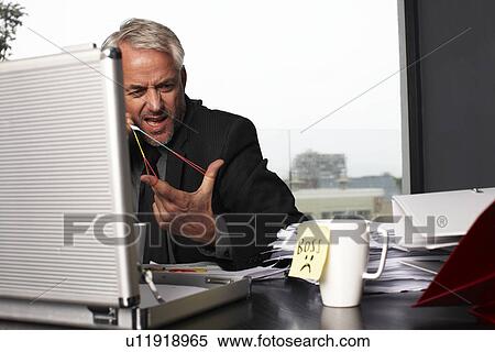 Stock Photography - Bored in the office. Fotosearch