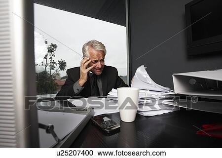 Boss at his desk View Large Photo Image Stock Image - Boss at his desk. Fotosearch