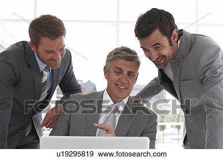 Boss showing something View Large Photo Image Stock Photo - Boss showing something. Fotosearch