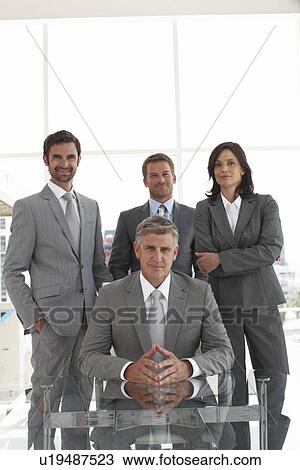 Stock Image - Boss with his team. Fotosearch