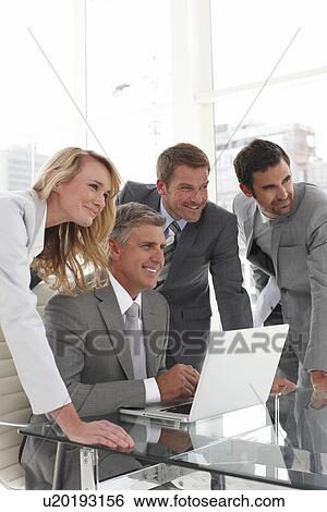 Stock Photograph - Boss with his team. Fotosearch