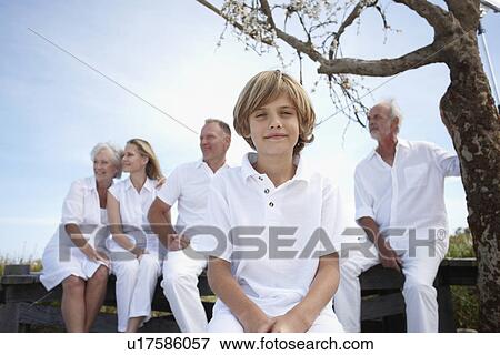 Boy with his family View Large Photo Image Stock Photo - Boy with his family. Fotosearch
