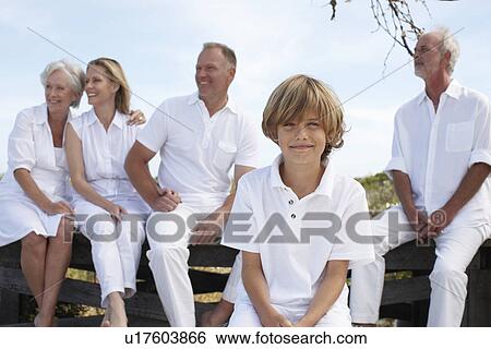 Boy with his family View Large Photo Image Stock Photograph - Boy with his family. Fotosearch