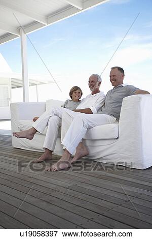 Boy with his father and grandfather View Large Photo Image Stock Photo - Boy with his father and grandfather. Fotosearch