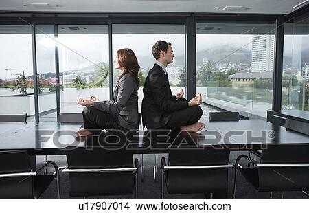 Business people doing yoga View Large Photo Image Picture - Business people doing yoga. Fotosearch