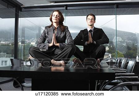 Business people meditating View Large Photo Image Stock Photography - Business people meditating. Fotosearch