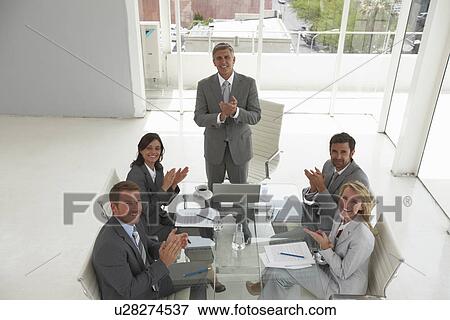 Stock Photo - Business team applauding. Fotosearch