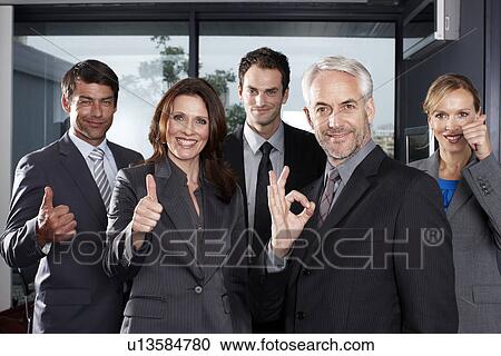 Business team doing OK sign View Large Photo Image Stock Image - Business team doing OK sign. Fotosearch